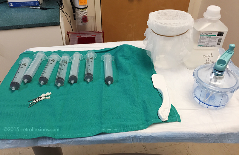 Top row from left to right: syringes, container with gauze, saline. Bottom row: spatula and mixer.